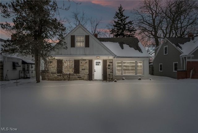 view of front of property with board and batten siding and stone siding