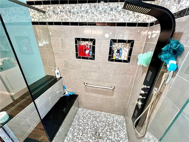 full bathroom with a tile shower