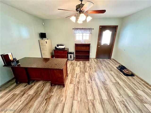 office with a ceiling fan and light wood-style floors