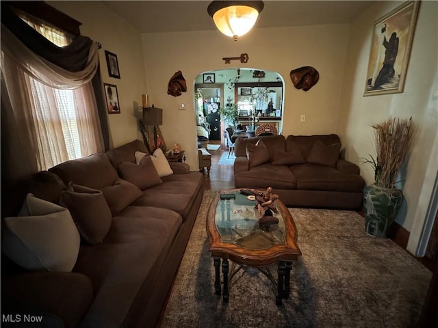 living room featuring arched walkways