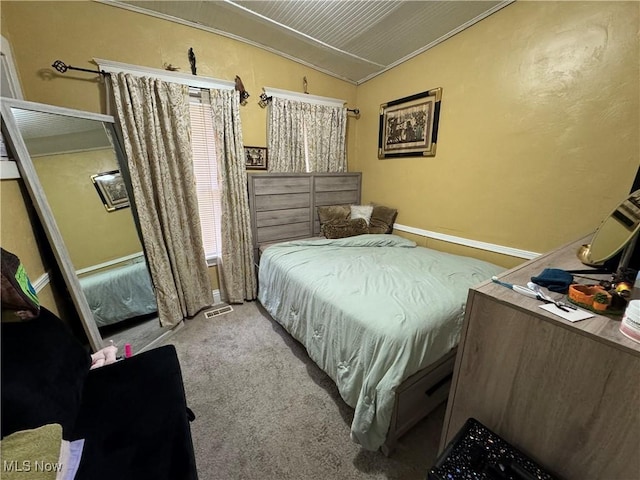 bedroom featuring light carpet and lofted ceiling