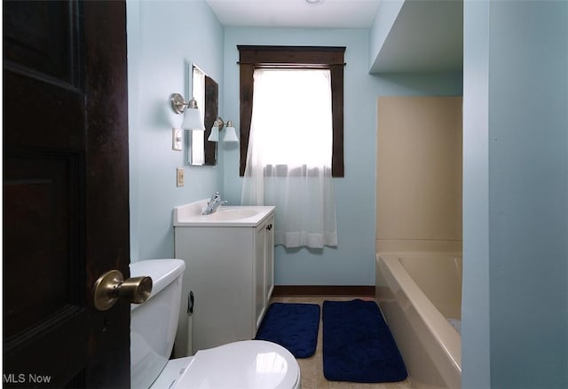 bathroom featuring toilet and vanity