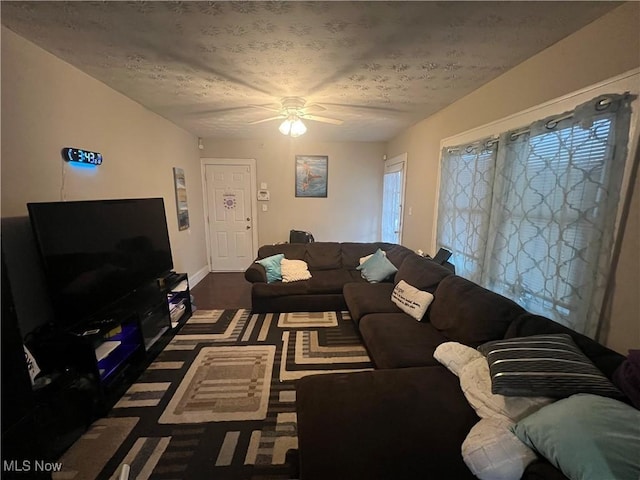 living area featuring a ceiling fan