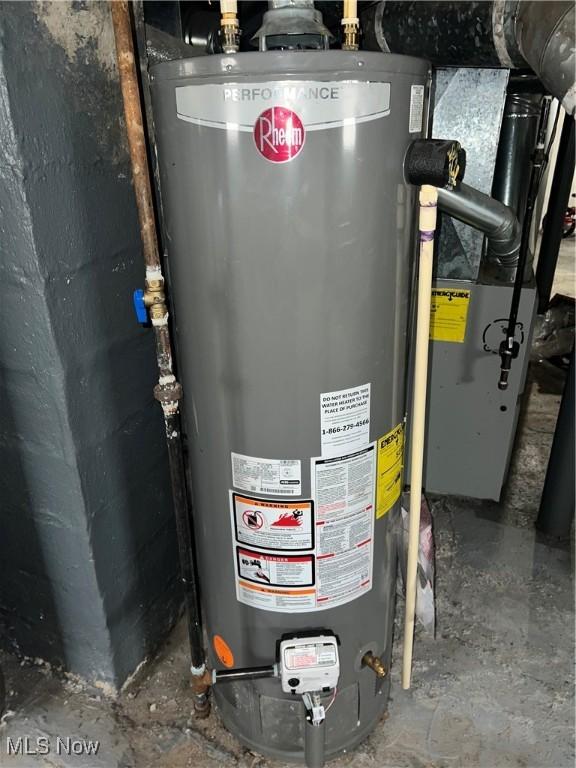 utility room featuring gas water heater