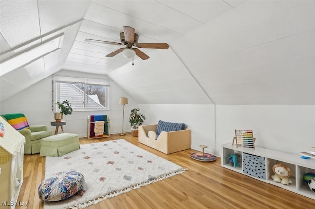 bonus room with lofted ceiling, ceiling fan, and wood finished floors