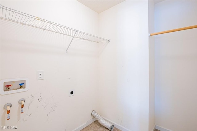 laundry area with washer hookup, gas dryer hookup, electric dryer hookup, laundry area, and baseboards