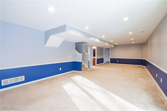 interior space featuring stairway, carpet flooring, visible vents, and recessed lighting