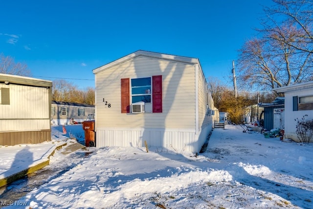 snow covered structure with cooling unit