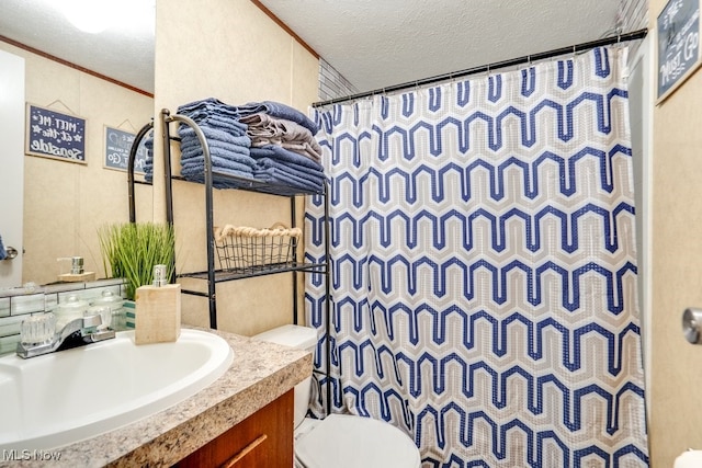 full bath with a shower with shower curtain, toilet, ornamental molding, a textured ceiling, and vanity