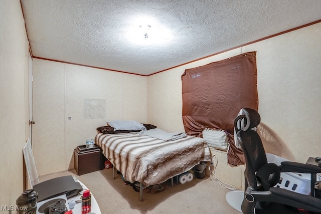 bedroom featuring a textured ceiling, ornamental molding, and carpet flooring