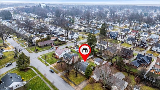 birds eye view of property with a residential view