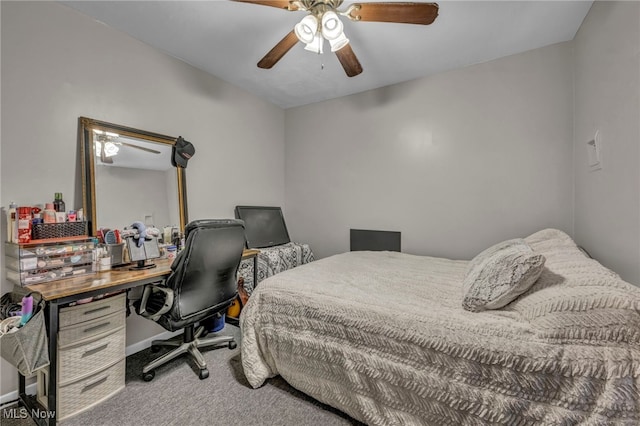 carpeted bedroom featuring ceiling fan and baseboards