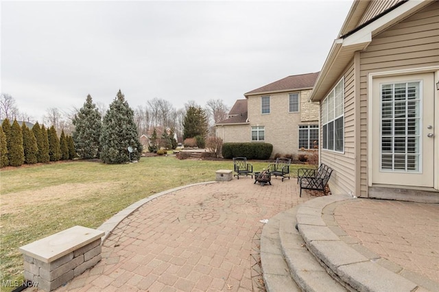 view of patio with a fire pit