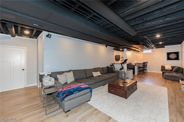 living room with light wood finished floors and baseboards