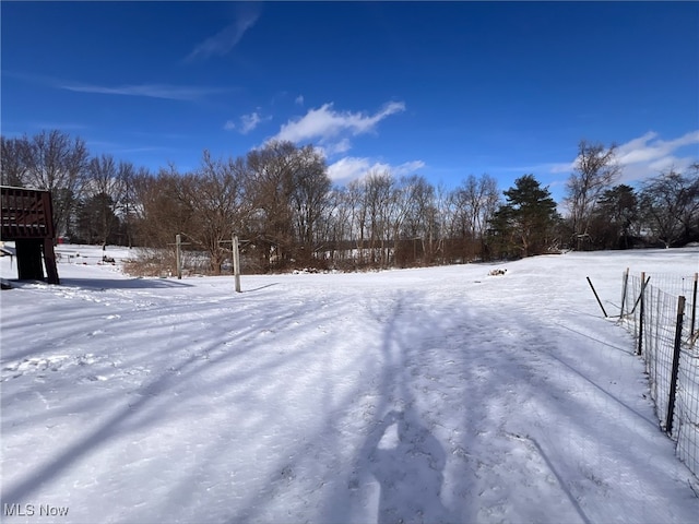 view of yard layered in snow