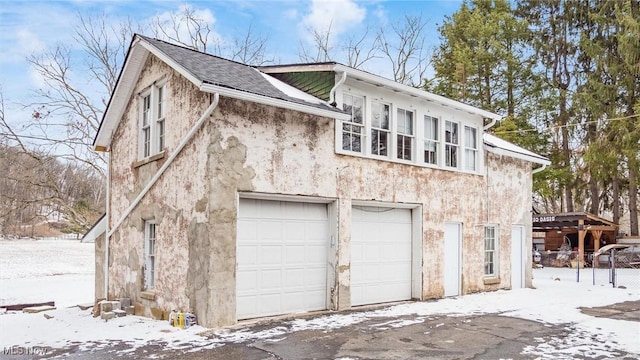 view of snow covered garage