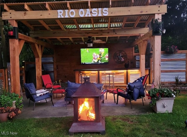 view of patio / terrace with a fire pit