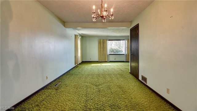 corridor featuring carpet flooring, a notable chandelier, visible vents, and baseboards