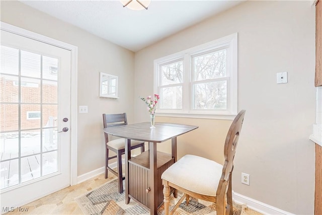 dining space with baseboards