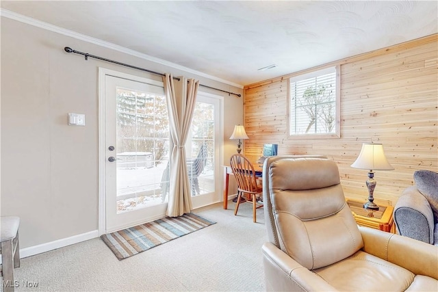 home office with wood walls, visible vents, baseboards, carpet, and crown molding