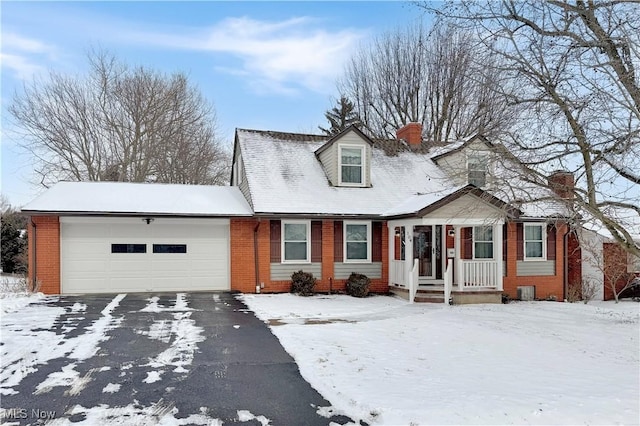 cape cod home featuring a garage, driveway, brick siding, and a chimney