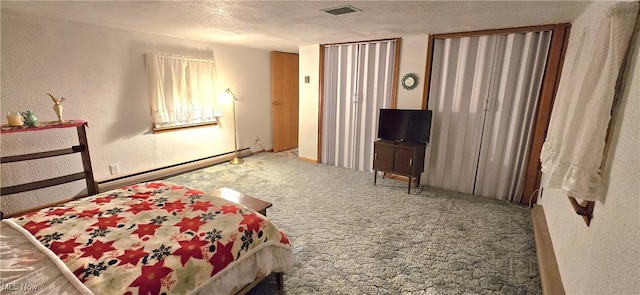 bedroom with visible vents, a textured wall, a textured ceiling, and carpet flooring