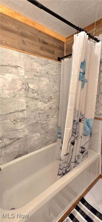 full bathroom with shower / bath combo with shower curtain