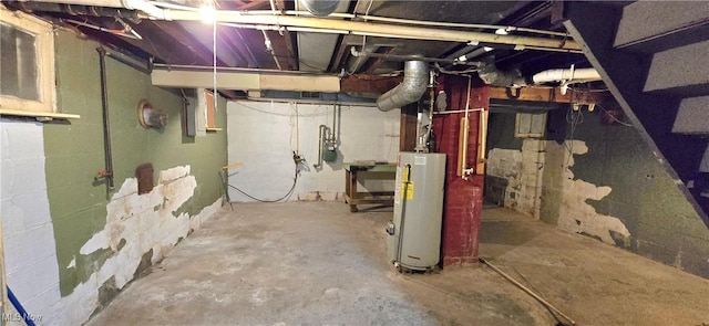 unfinished below grade area featuring water heater