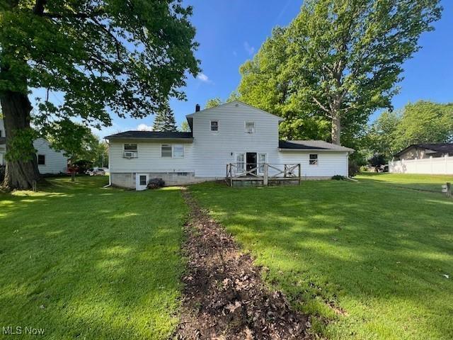 3335 N Maple Ln, Ashtabula, OH 44004 - rear view of property with a yard
