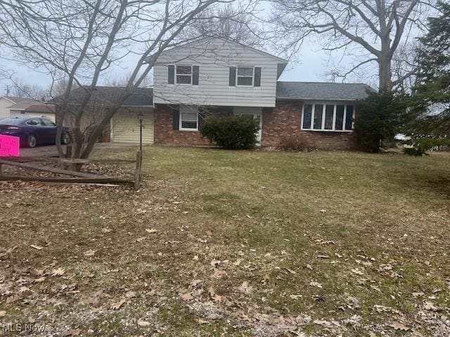 3335 N Maple Ln, Ashtabula, OH 44004 - view of side of property featuring brick siding and a yard
