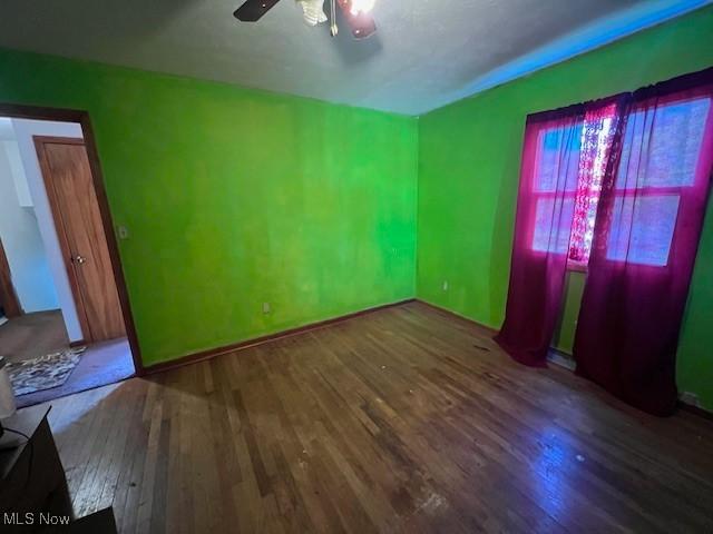 3335 N Maple Ln, Ashtabula, OH 44004 - spare room featuring wood finished floors, ceiling fan, and baseboards