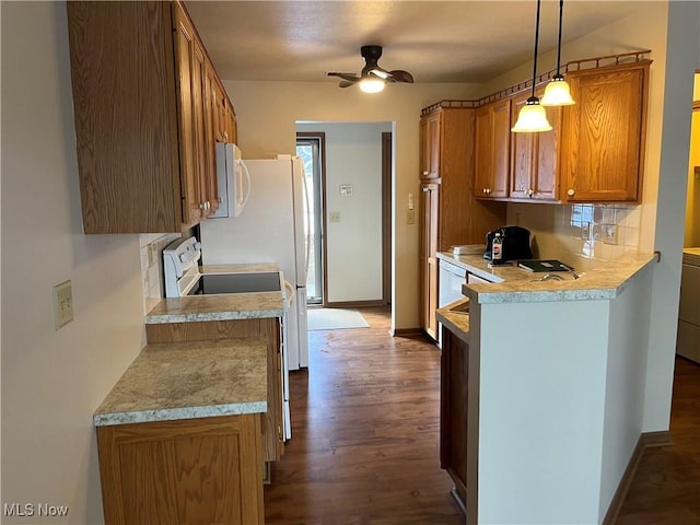 kitchen with light countertops, hanging light fixtures, decorative backsplash, brown cabinetry, and white appliances