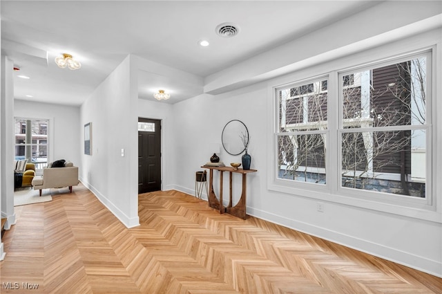 entryway with recessed lighting, visible vents, and baseboards