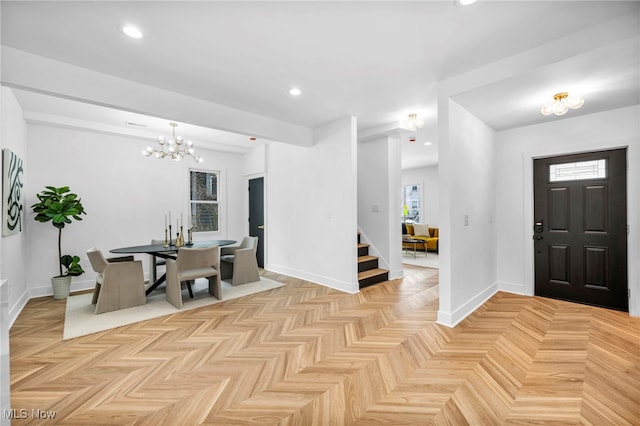 entryway with stairs, baseboards, a notable chandelier, and recessed lighting