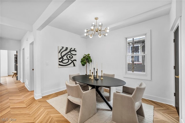 dining area with an inviting chandelier and baseboards