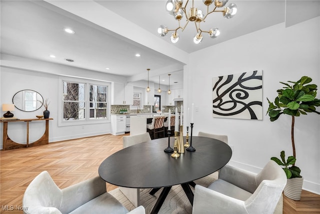 dining room with recessed lighting, baseboards, and an inviting chandelier