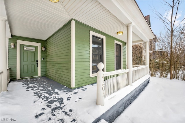 view of snow covered property entrance