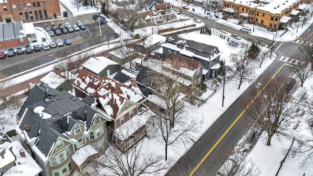 snowy aerial view with a residential view