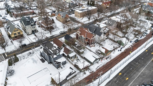 snowy aerial view featuring a residential view