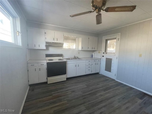 kitchen with white range with electric cooktop, light countertops, white cabinetry, a sink, and under cabinet range hood