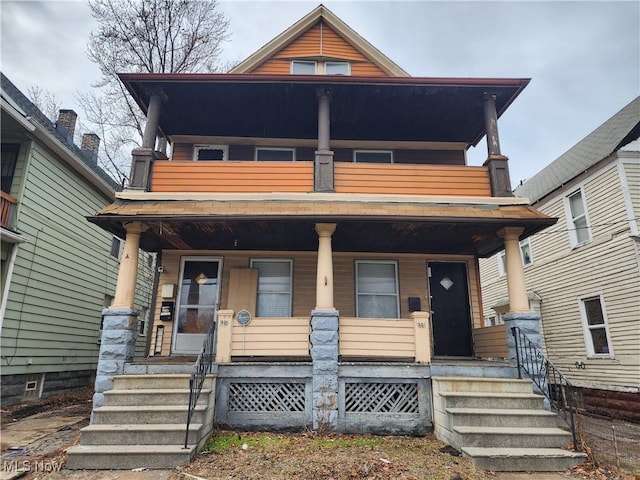 view of front facade featuring a porch and a balcony