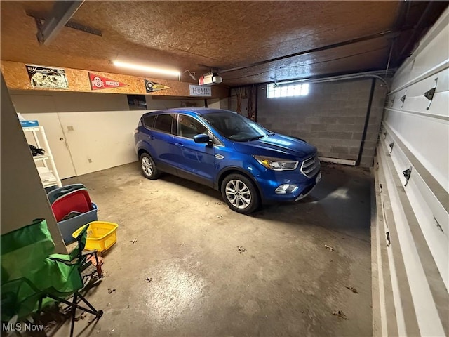 garage with concrete block wall