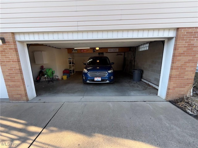 garage with concrete driveway