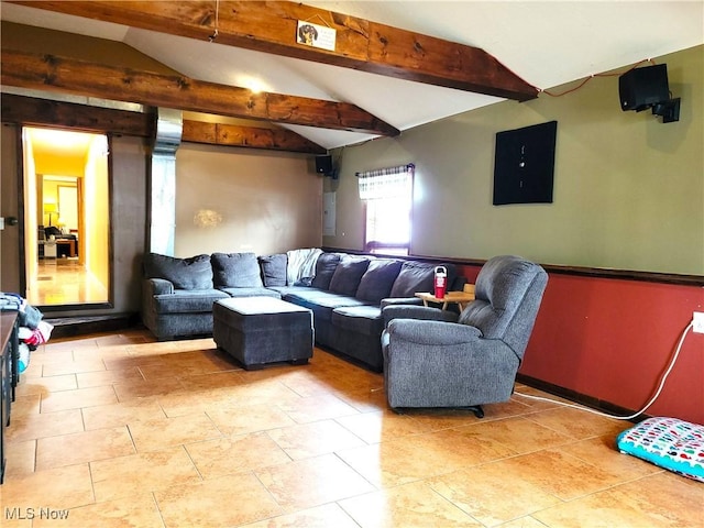 living room featuring tile patterned flooring, electric panel, and vaulted ceiling with beams