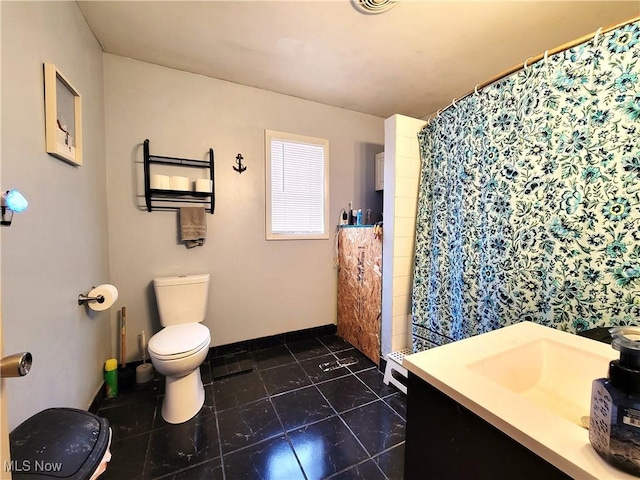 full bathroom featuring vanity, a shower with shower curtain, tile patterned flooring, and toilet