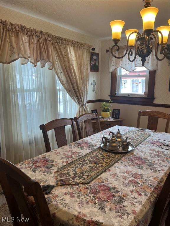 dining room with a notable chandelier