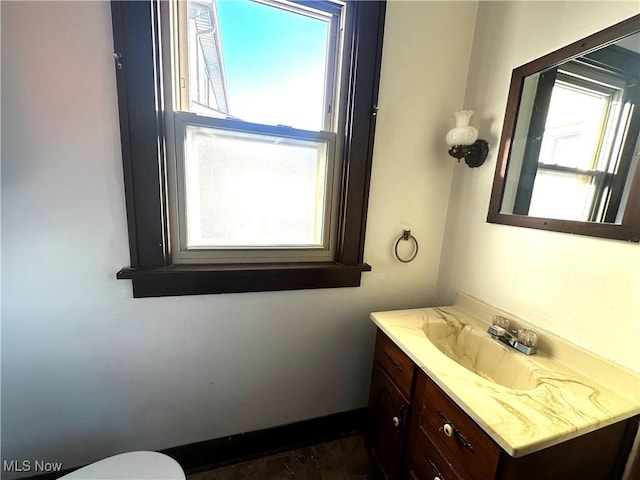 bathroom featuring vanity and baseboards