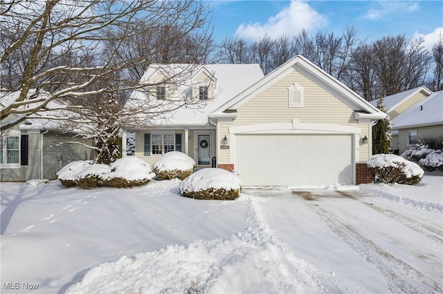 view of front of home with a garage and brick siding