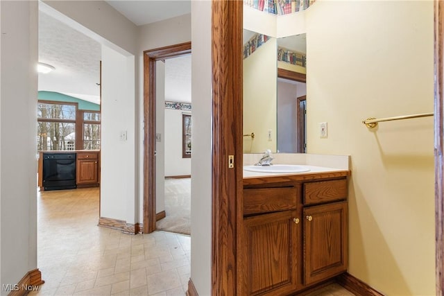 bathroom featuring baseboards and vanity