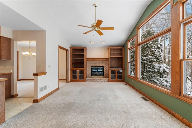 unfurnished living room with light carpet, a brick fireplace, baseboards, and visible vents